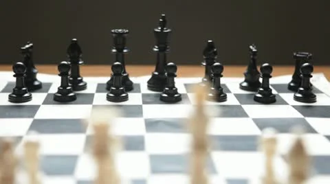 Dolly shot of chess board moving towards opponent Stock Footage 20535601
