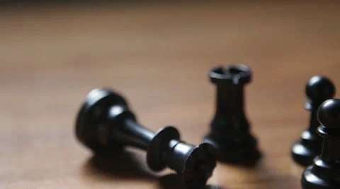 Dolly shot of chess queen piece fallen down Stock Footage