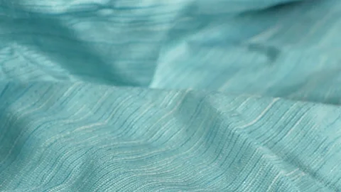 Dolly shot close up detailed cloth texture of shiny cloth. Stock Footage 146937341