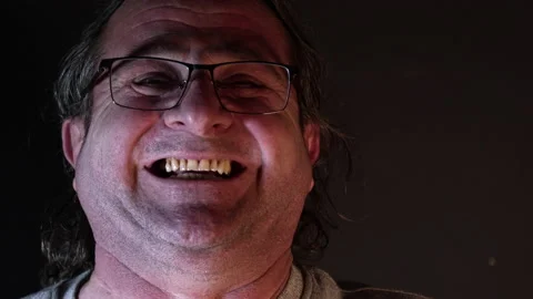 Dolly Shot of Close Up Old Man Very Cheerful And Laughing Stock Footage 169548603