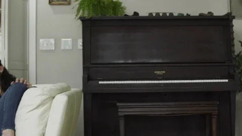 Dolly shot of a couple using a laptop at home 스톡 동영상 73249203