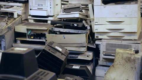 Dolly shot of dump of old office equipment. Broken outdated electronic devices. Stock Footage 143974425