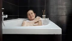 Bubble bath for woman taking , blow on f, Stock Video