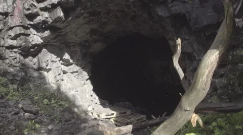 Dolly shot from the entrence of the cave Stock Footage 52850374