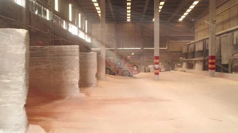 Dolly Shot Grader Moving Clay Soil in Ceramic Factory Warehouse Stock-Footage 166697085