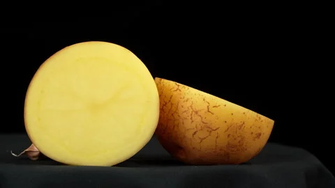Dolly Shot of Halved Raw Potato Cross Section Stock Footage 343593060
