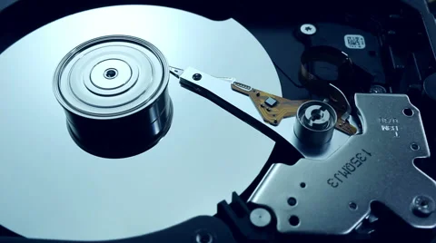 Dolly shot of Hard disk drive with spinning platter Stock Footage