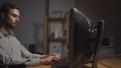 Dolly shot of IT man writing programming code Stock Footage 75015183