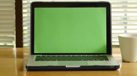 Dolly shot - Laptop computer with green screen monitor Stock Footage