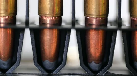 A Dolly shot of large caliber bullets in production line Stock Footage 58029115