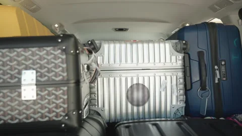 Dolly in shot of loaded van trunk with suitcases, preparation for family Stock-Footage 304962764