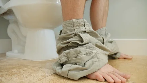 Dolly shot of a man using the restroom in his home Stock Footage 91481111