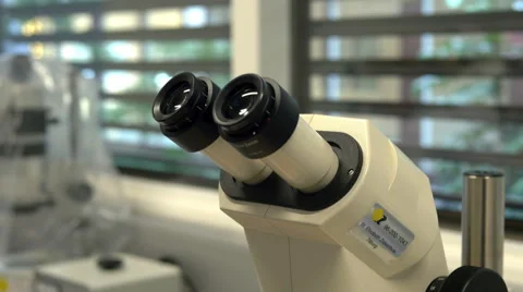 A dolly shot of a medical microscope which is used for artificial insemination Stock Footage 42319152