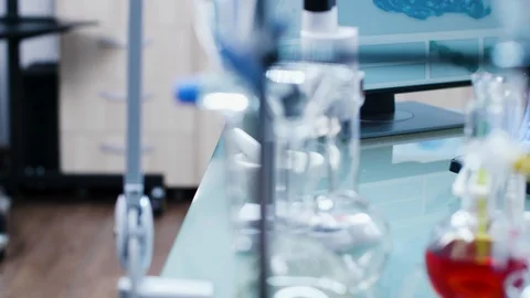 Dolly shot of modern high end laboratory elements, tubes and colored liquids Stock Footage 108733070