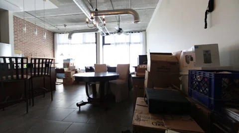 Dolly Shot of Moving Boxes In Loft Living Room 2 Stock Footage 46631563