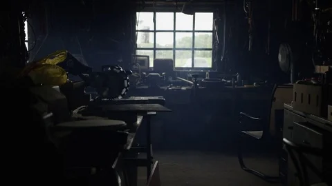 Dolly shot of musty workshop full of tools Video stock 81493562