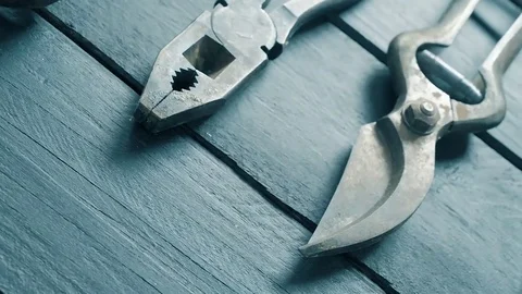 Dolly shot on old tools on a dark table Vídeo Stock 74723625