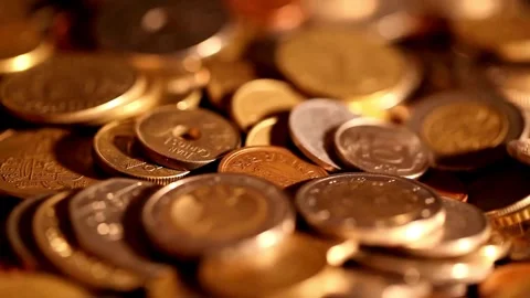 Dolly shot over various gold coins Saving Money and Gold - 4K Resolution Dolly Stock-Footage 334027845
