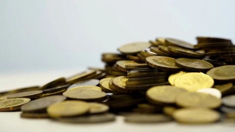 Dolly shot over various gold coins Gold Treasure Saving money and loan for Vídeos de archivo 334028289