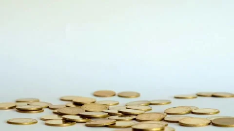 Dolly shot over various gold coins Saving Money and Gold - 4K Resolution Dolly Video stock 334028592