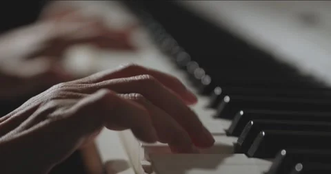 Dolly shot of pianist's hands play the piano excellently Stock Footage 198889853
