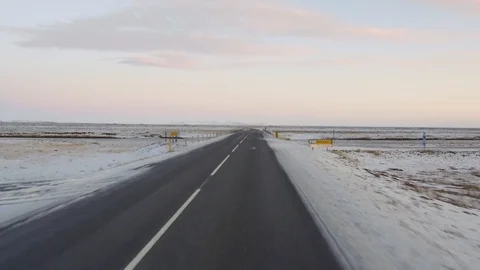 Dolly shot POV driving in an empty country road covered with snow during winter Stock Footage 94144857