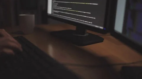Dolly shot of professional programmer hacking Stock Footage 75015786