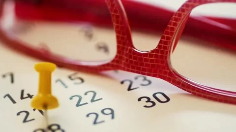 Dolly shot Push pin on a calendar Stock Footage 49162570