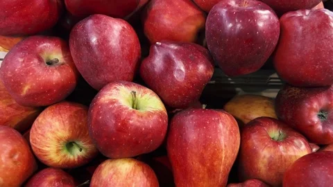 Dolly shot on red apples displayed on fruit stand Stock Footage 267896025