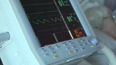 Dolly shot reveals sleeping elderly patient Stock Footage 73434081