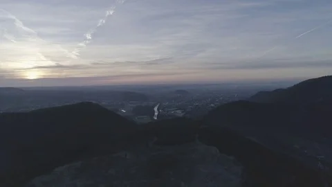 Dolly shot of a rock mining complex in the sunrise light over the city Graz, 4K Stock Footage 73795454