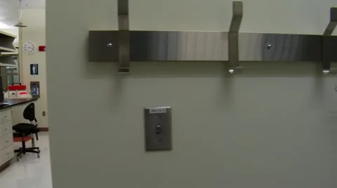 Dolly shot of scientists at work in large laboratory Stock-Footage 21529790