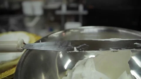 Dolly shot of a spatula with icing Stock Footage 231414625