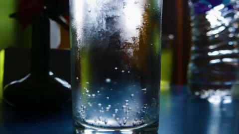 Dolly shot of Sprite cold drink in a glass with bubbles going up Stock Footage 247813410