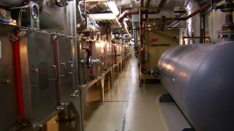 Dolly shot through complex machine room 스톡 동영상 21530647