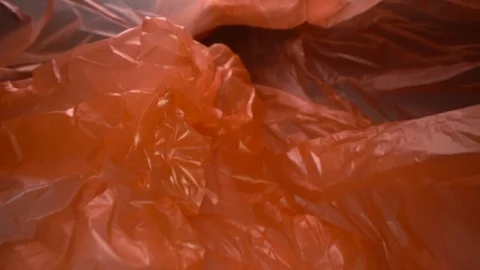 Dolly shot through disposable plastic bag background. Transparent, reusable Stock Footage 107808694
