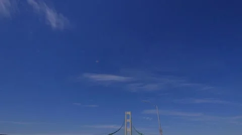 Dolly shot up at the  tower and supporting cables of the Mcackinac Bridge Stock Footage 68950827