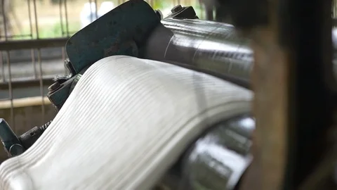 A dolly shot Transform process of rubber industry process to raw sheets Stock Footage 89995272