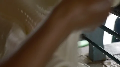 A dolly shot Transform process of rubber industry process to raw sheets Stock Footage 89995416