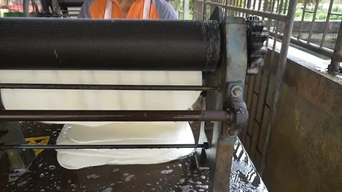 A dolly shot Transform process of rubber industry process to raw sheets Stock Footage 89995835