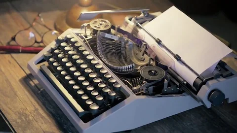 Dolly shot: typewriter lit by a table lamp Stock Footage 73763458
