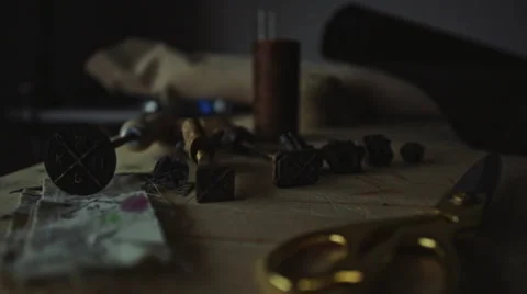 Dolly shot of various tools for crafting leather goods Stock Footage 61034009