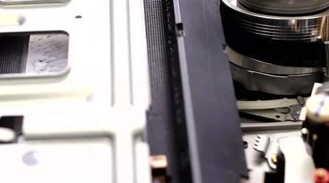 Dolly shot VCR VHS player insert tape Stock Footage 61478872