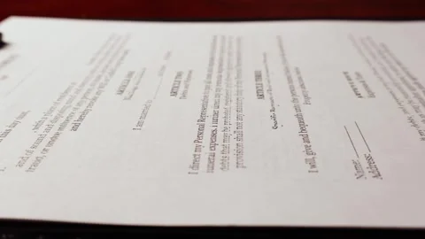 Dolly shot of will and testament important form document on table Stock Footage 266085055
