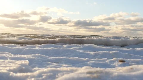 Dolly shot of winter sea and icy shore with clouds time lapse Stock Footage 59160644