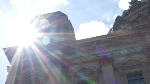 Dolly slide looking up at the Berlin Cathedral facade with sunflare Видео 282558786