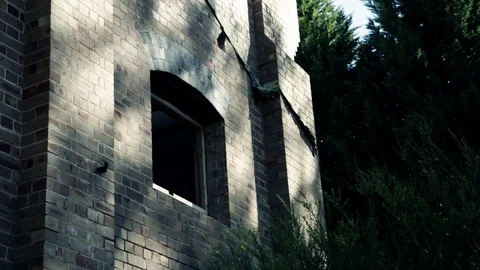 Dolly slider shot of the front of an old warehouse building Stock Footage 81464871