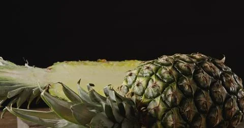 Dolly slow motion close up video fresh juicy exotic fruit pineapple on a cu.. Stock Photos
