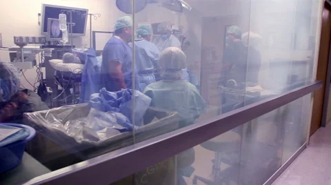 DOLLY IN. Surgeon preparing the OR for surgery Stock Footage 45826451