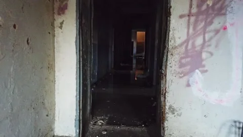 Dolly in through dark abandoned building hall Stock-Footage 204001278